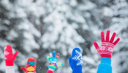 Festive mittens in the air